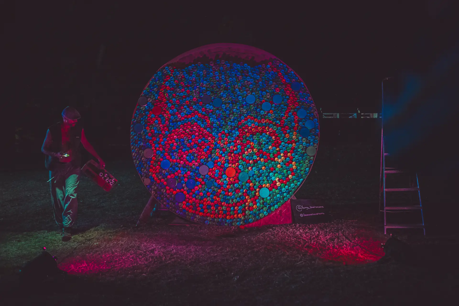 Artist Burry Buermans creating a live art installation at Boom Festival 2023, curated by Because Art Matters.