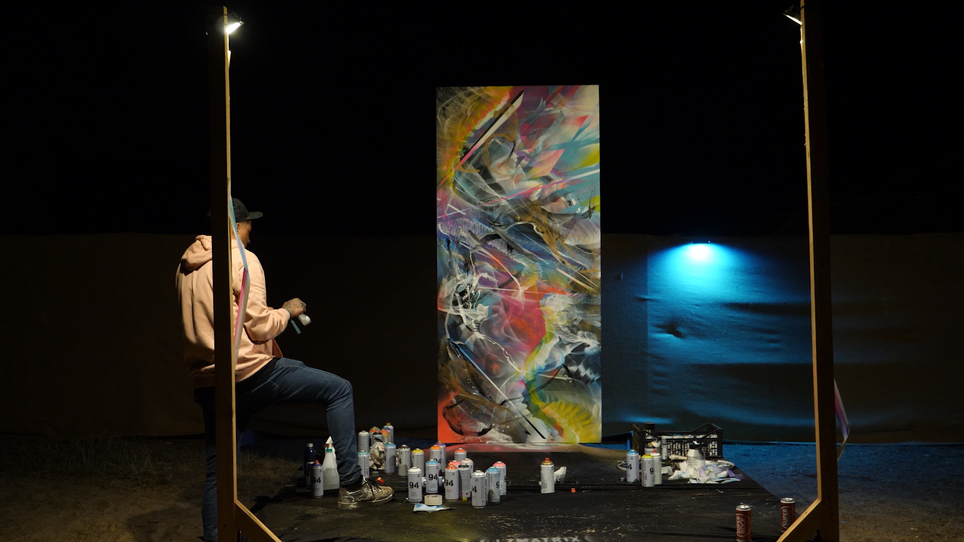 Artist L7Matrix performing a live painting session on canvas at Boom Festival 2023, curated by because art matters