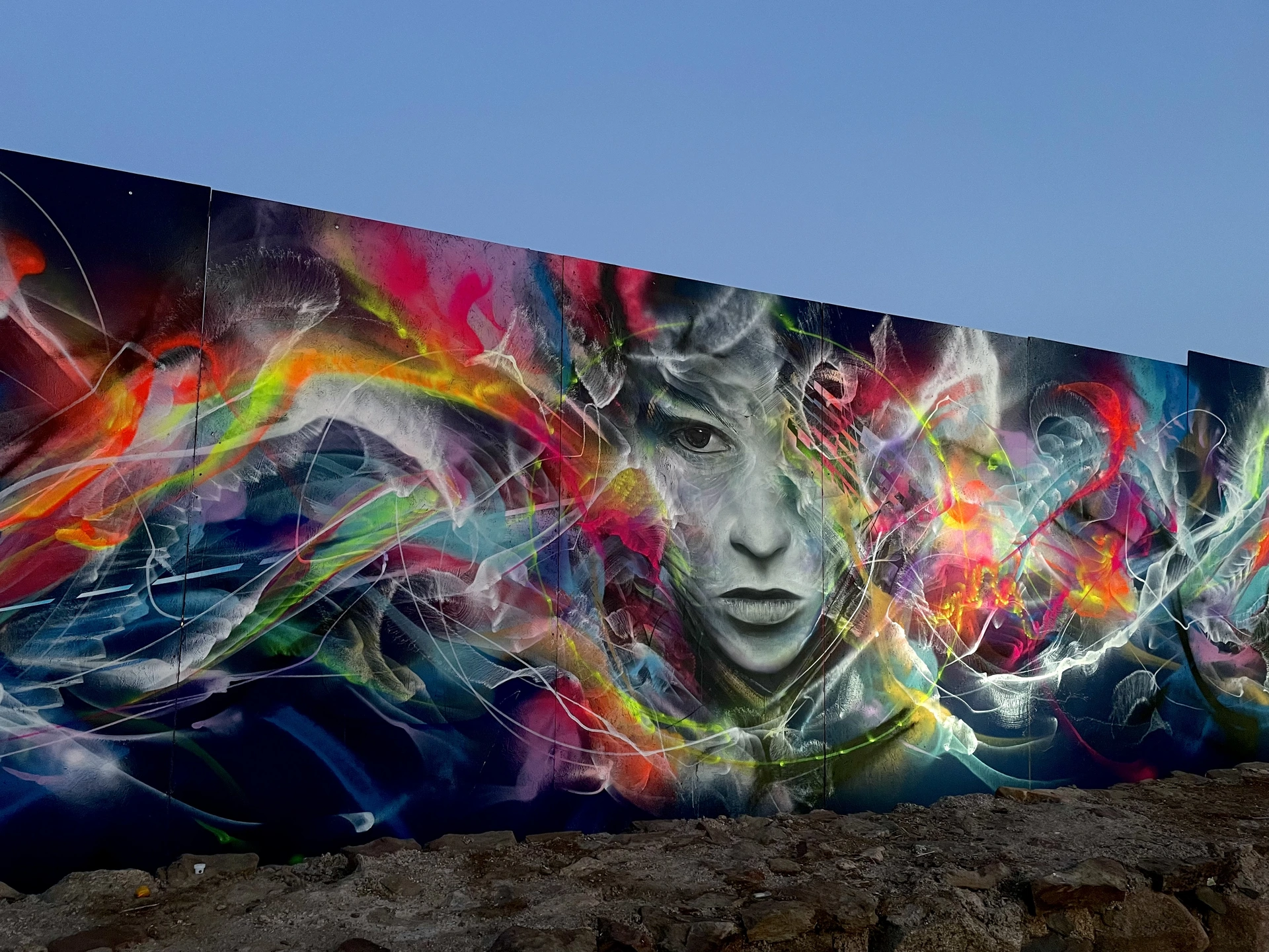 Large-scale psychedelic art mural by L7 Matrix, created live during the Because Art Matters collaboration at Boom Festival 2023.