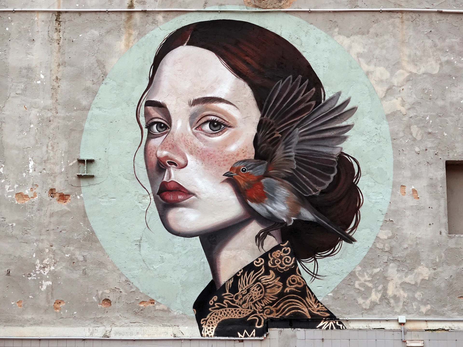 “The Robin’s Whisper” Street art mural by Patrícia Mariano for the Walls That Matter project, curated and produced by Because Art Matters gallery in Marvila, Lisbon.